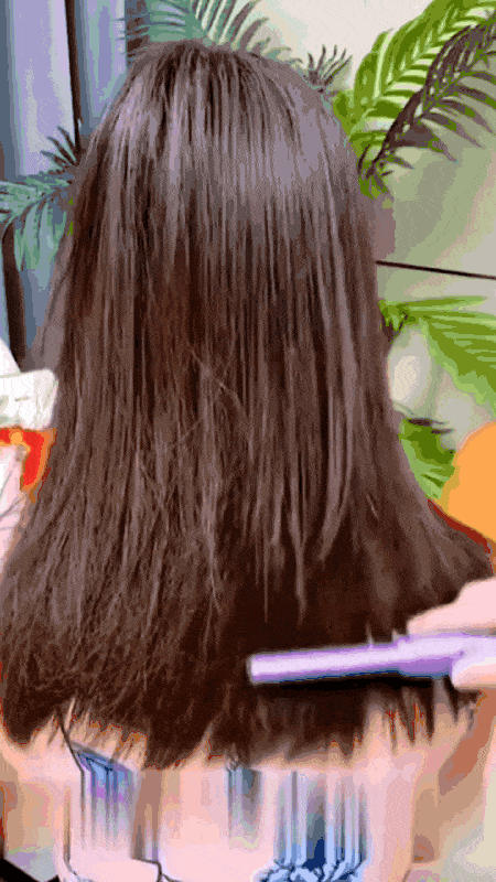 Woman using Meneflix Cordless Mini Hair Straightener for smooth styling